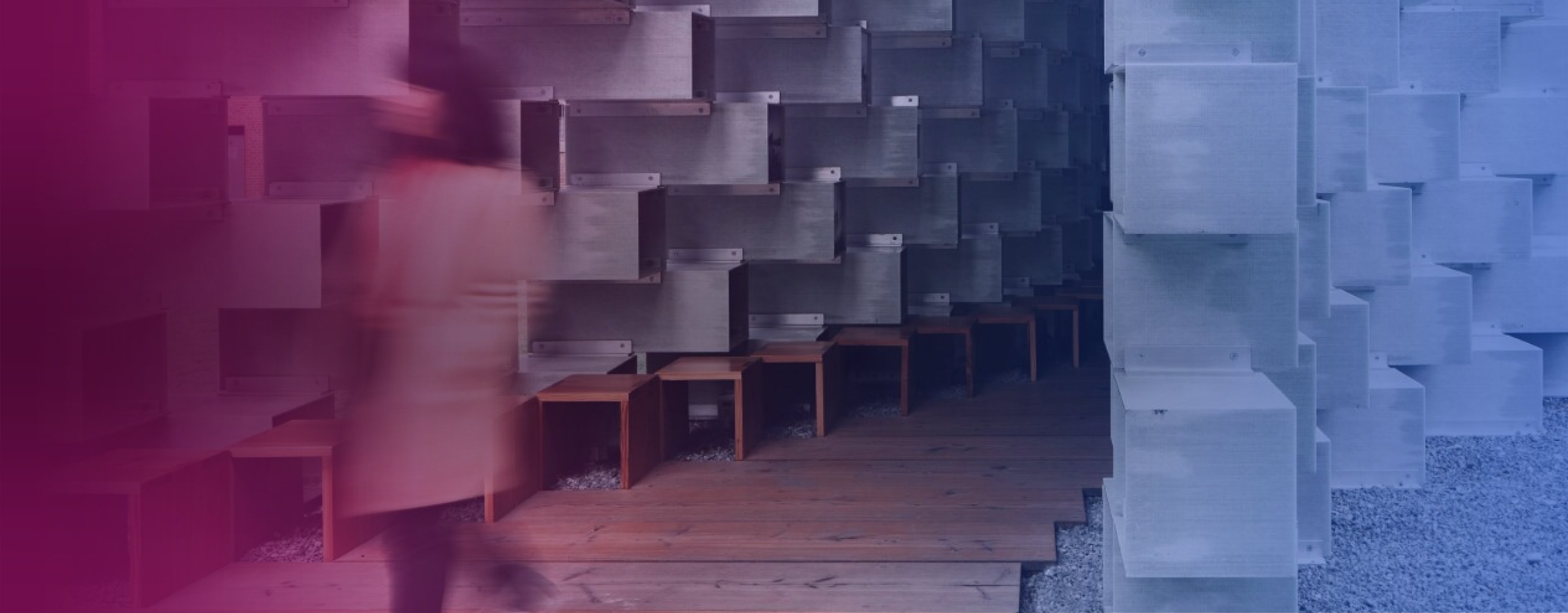 A stock image of a person walking past a building